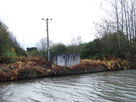A concrete pillbox by the canal