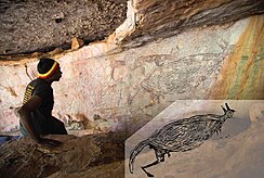 Depiction of kangaroo painting with added drawing for clarity - examined by Traditional Owner Ian Waina on the left. Kangaroo-Painting.jpg