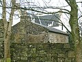 The vaulted chamber building with the 17th century house in the background.