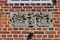 Deutsch: Relief über dem Seiteneingang der Kirche in Sülfeld. This is a photograph of an architectural monument. It is on the list of cultural monuments of Sülfeld, no. 2.1