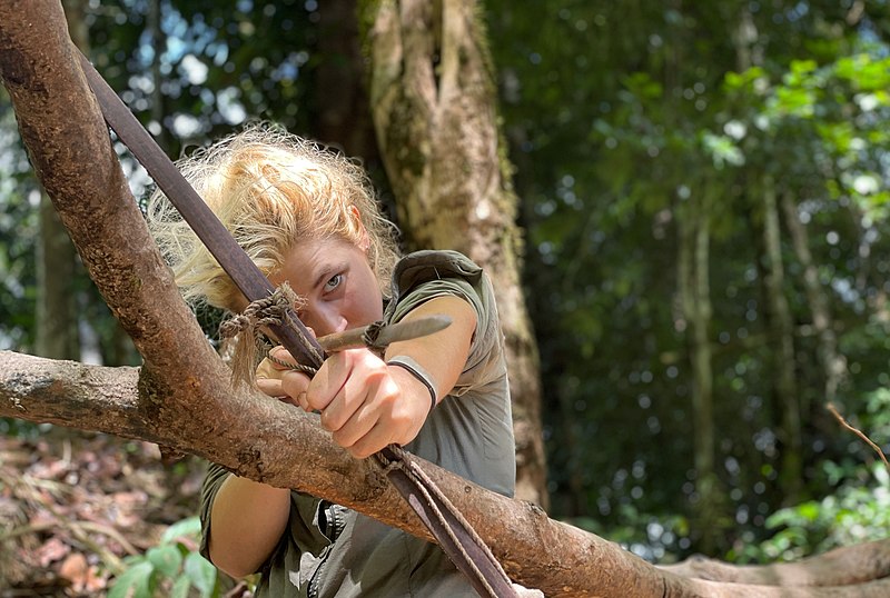 File:Lucy Shepherd in jungle with bow and arrow.jpg