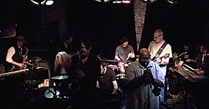 M'lumbo onstage at Bowery Electric March 2, 2013 with Page Hamilton. Left to right: Vin Veloso, Maureen O'Connor, Brian O'Neill, Paul Meurens, Jarek Szczyglak, Jaz Sawyer, Cecil Young, Page Hamilton, Dehran Duckworth, Rob Ray.