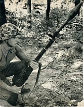 U.S. Marine preparing to fire M31 HEAT antitank rifle grenade from M1 rifle in the indirect mode with butt on the ground M31HEAT-RifleGrenade.jpg