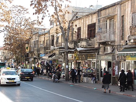 Haredi Jews walk along Malkhei Yisrael Street in Jerusalem.