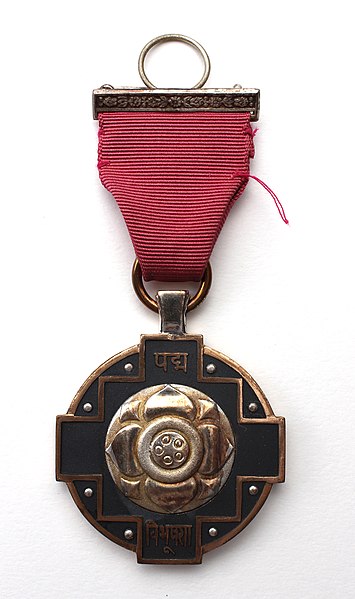 Padma Vibhushan medal suspended by a ribbon