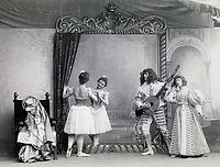 The Scène dansante: Le coquetterie devant le miroir from act II/scene 1. Pictured, from left to right, is Pierina Legnani as Ysaure de Renoualle (with back turned), Claudia Kulichevskaya as her friend, Sergei Legat as Arthur, and Olga Preobrajenskaya as Anne de Renoualle.