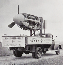 The truck has signs reading "2,400 Horsepower!! The power behind the Typhoon & Tempest fighters" and "Napier Sabre - The most powerful aero engine in service in the world", plus the Napier logo