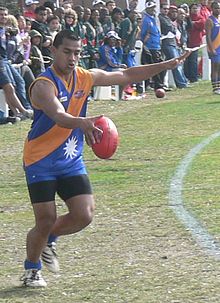 Action from the 2008 Australian Football International Cup featuring Nauruan player kicking a Sherrin Nauru player kicking for goal 1.jpg