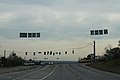 Overhead road signs on Eisenhower Parkway EB before Broadway