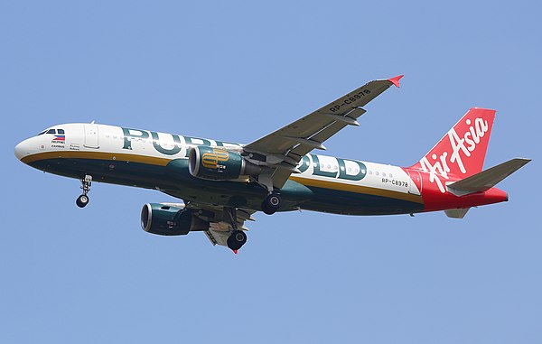 An Airbus A320-200 operated by Philippines AirAsia in Puregold livery, on final approach at Taoyuan International Airport.