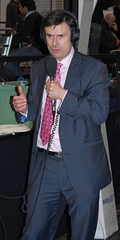 Peston reporting for the BBC, 2009 Robert Peston does radio (cropped).jpg