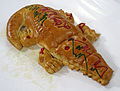 Roti buaya, crocodile-shaped bread is often served in festive occasions.