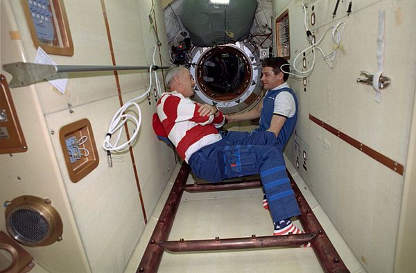 STS-79 commander Readdy (left) and Mir EO-22 commander Korzun (right) in Mir's Docking Module