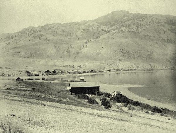 South shore warehouse in foreground and north shore settlement in background, Savona, c.1885