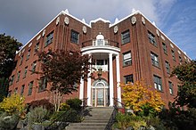 The Barbara Frietchie in the International Village, built 1929, combines Colonial Revival with Zig Zag Moderne. Seattle - 1100-1102 17th Ave 02.jpg