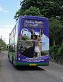 The rear of Southern Vectis 1055 Little Stairs Point (YN03 DFP), a Scania OmniDekka in Ventnor Road, Whitwell, Isle of Wight on route 6. It has recently had it's rear advert applied for the Isle of Wight Donkey Sanctuary with the incorrect spelling of Wroxall.