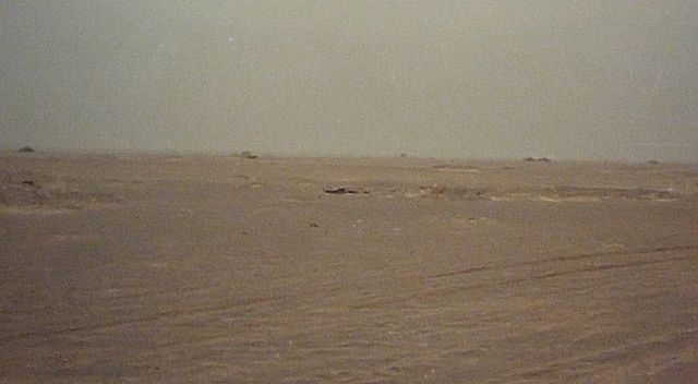 An Iraqi defensive position in Task Force 1-41 Infantry's sector of operations during the Battle of 73 Easting. The tops of Iraqi tanks can be seen as
