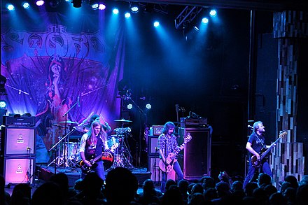 The current lineup of The Sword comprises Kyle Shutt, Santiago "Jimmy" Vela III, J. D. Cronise and Bryan Richie. TheSword-ObservatorySantaAnaCA-20130801.JPG