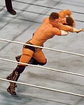 Miz performing the Skull Crushing Finale on Zack Ryder in April 2016