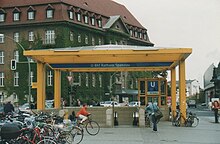 Entrance to the U-Bahn station, which is named after Spandau townhall, seen behind U-Bahn Berlin Rathaus Spandau Eingang.jpg