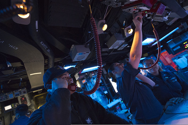 File:U.S. Navy Operations Specialist 2nd Class Nathon Larson, left, and Operations Specialist 2nd Class Kai Varela relay voice messages June 29, 2013, in the combat information center aboard the amphibious dock 130629-N-WD757-030.jpg