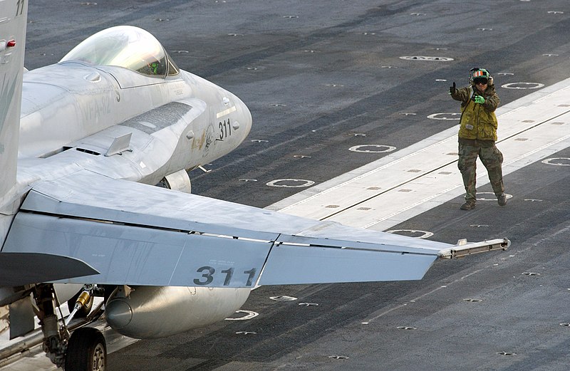 File:US Navy 021109-N-1328C-501 Directing a Hornet to a catapult.jpg