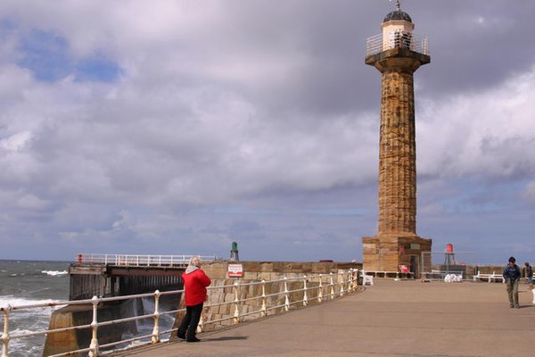 Image: Whitby lighthouse and West Pier.   geograph.org.uk   1077167