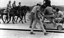 Peckinpah (far right) directs the opening scene as the Bunch ride into Starbuck.