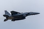 An F-15E Strike Eagle, tail number 91-0320, taking off from RAF Lakenheath in England. The aircraft is assigned to the 494th Fighter Squadron.