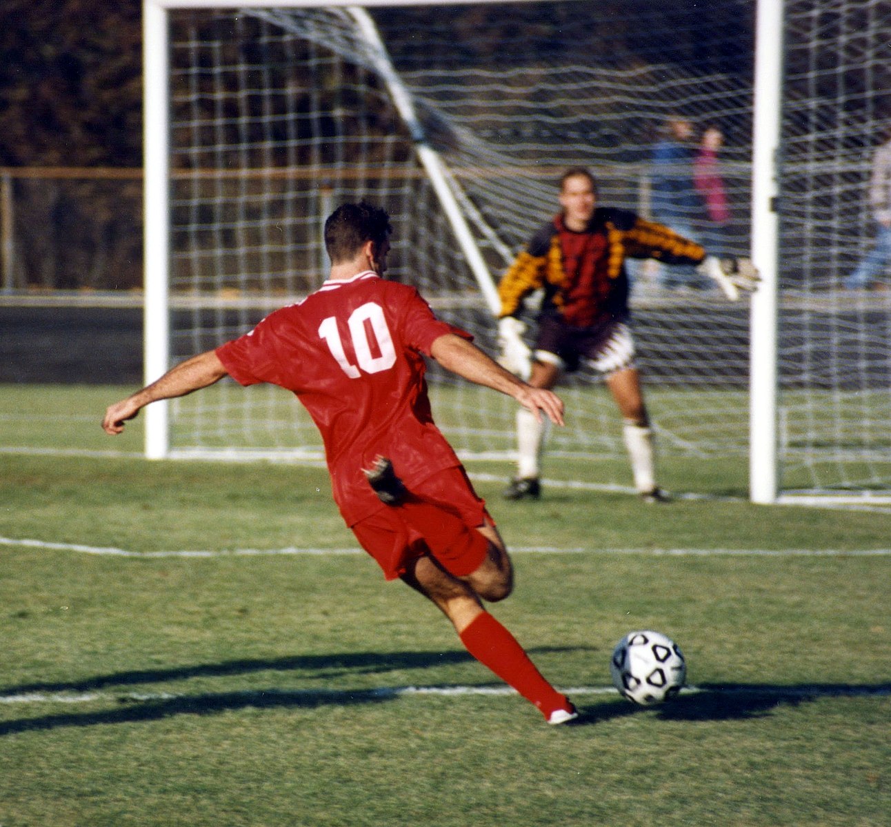 1292px-2_guys_playing_soccer_-_good.jpg?