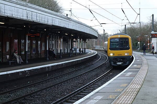 A Class 323 train entering Sutton Coldfield Railway Station in 2024.