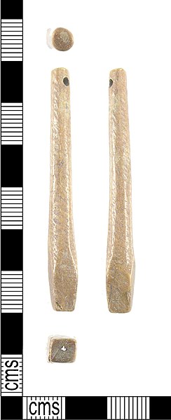 Medieval bone tuning pin. One end is pierced for the string; the other is squared off to fit in a tuning lever socket. The middle section, which would