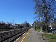 The outbound platform at Allendale station in 2014. The station depot is located on the left Allendale station outbound platform.jpg