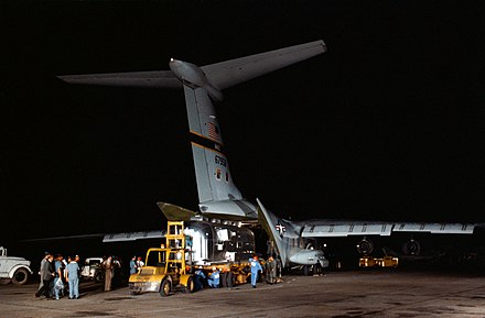 The Apollo 11 Mobile Quarantine Facility is unloaded from a C-141 at Ellington Air Force Base, 27 July 1969.