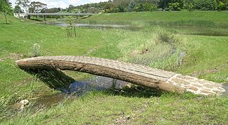 Middle Street Bridge in Walcha (background) and river dikes on the Apsley River