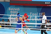 Deutsch: Boxen bei den Olympischen Jugendspielen 2018 Tag 12, 18. Oktober 2018 - Finale im Leichten Weltergewicht Jungen – Ilia Popov (Russland, rot) schlägt Talgat Shaiken (Kasachstan, blau) 4-1; Ringrichter ist James Beckles (Trinidad und Tobago). English: Boxing at the 2018 Summer Youth Olympics on 18 October 2018 – Final Light Welterweight Boys Bout - Ilia Popov (Rusia, rojo) supera a Talgat Shaiken (Kazajstán, azul) 4-1; Referee is James Beckles (Trinidad and Tobago). Español: Boxeo en los Juegos Olímpicos Juveniles de Verano de 2018 en 18 de octubre de 2018 - Chicos de peso welter ligero final: Ilia Popov (Uzbekistán, roja) le gana a Talgat Shaiken (Egipto, azul) 4-1; El árbitro es James Beckles (Trinidad y Tobago).