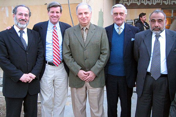 Paul Bremer (second from left) and four members of the Iraqi Governing Council; Mowaffak al-Rubaie, Ahmed Chalabi, Adnan Pachachi, and Adil Abdul-Mahd