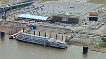 The Casino Queen in 2006 with the White Star One riverboat in the foreground and the hotel tower in the background Casino Queen.jpg