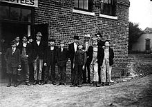 Group of men and boys at Friedman Shelby Shoe Company in 1910 Child workers in Kirksville, MO.jpg