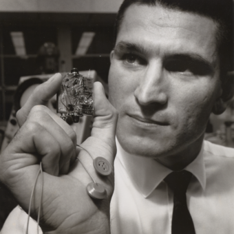 Chuck Kayser with electroencephalograph electrodes and a signal conditioner for use in Project Gemini, 1965