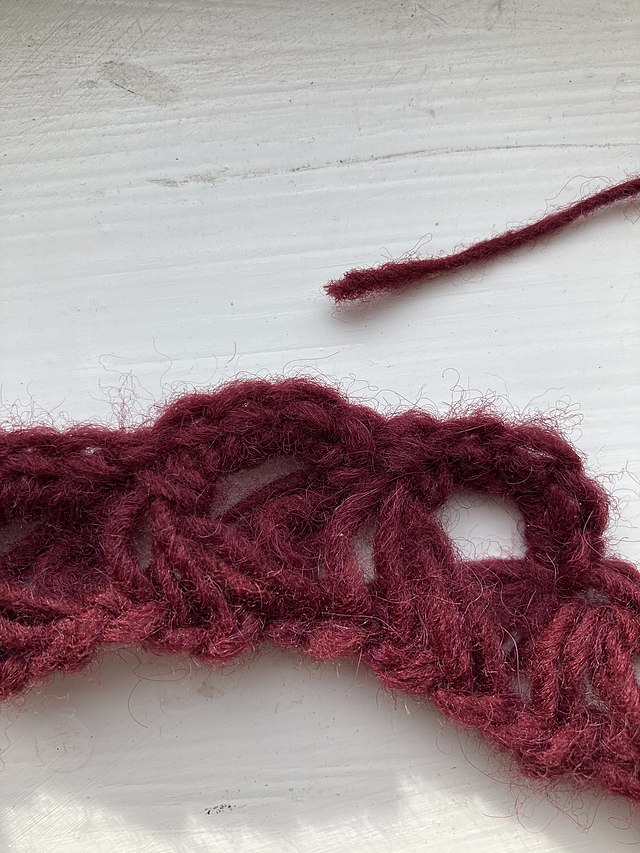 Red broomstick lace