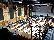 The stage and interior of the Cambridge Corn Exchange viewed from the balcony during a hackathon Cmglee Cambridge Corn Exchange hackathon.jpg