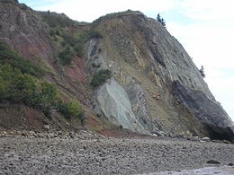 Part of the Cobequid fault zone exposed in cliffs to the west of Clarke Head, near Parrsboro, Nova Scotia, juxtaposing Lower Carboniferous Windsor Group against Upper Triassic to Lower Jurassic Blomidon group. Cobequid fault zone near Clarke Head.JPG