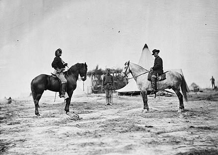 Custer (left) with General Pleasonton on horseback in Falmouth, Virginia, 1863