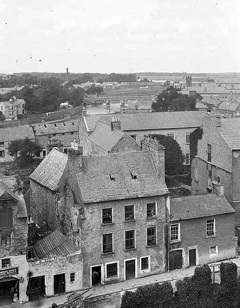 File:Elevated view of buildings in a town, one of the buildings has the sign "Thomas Hart, Marine dealer" (22844068380).jpg