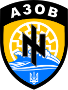 Shield, showing sunwheel, waves, Social-National Assembly logo, and national trident