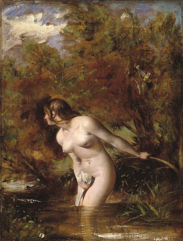 Naked woman standing in a stream.
