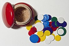 A European red wooden mushroom-style tiddlywinks container with smaller nylon wink discs and larger nylon squidger discs (1960s) Flohspiel hg.jpg
