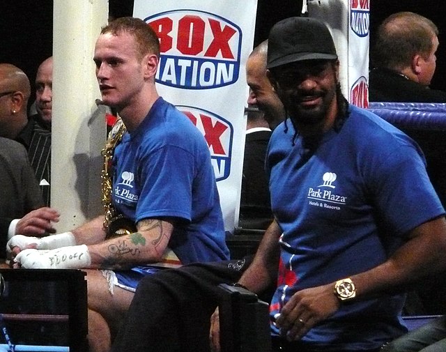 Haye with Adam Booth (centre) and George Groves, 2011. Haye promoted Groves from 2008 to 2009.