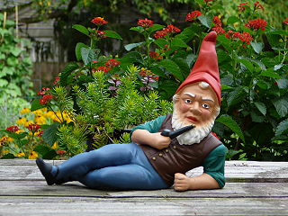 Garden gnome statue of a dwarf-like creature intended as a garden ornament